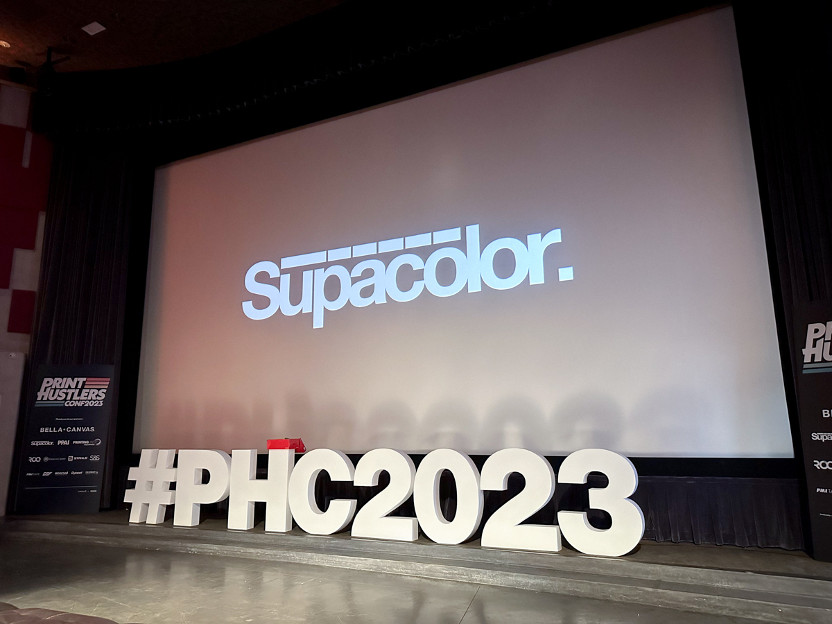 Apparel decorators and vendors gathered at The New Port Theater in Newport Beach, California, November 4-6 for Print Hustlers Conference 2023, hosted by MADE Laboratory. Attendees took part in Printavo and Inktavo User Summits at Liquid Graphics, engaged in a day and a half of speaker sessions emceed by Justin Lawrence of Oklahoma Shirt Company, and received a behind-the-scenes tour of Bella + Canvas’ Commerce, California, facility. Next year’s event is scheduled for November 2-4, 2024, at The Rock and Roll Hall of Fame in Cleveland, Ohio. Click through the slideshow for key takeaways and photos from the three-day event