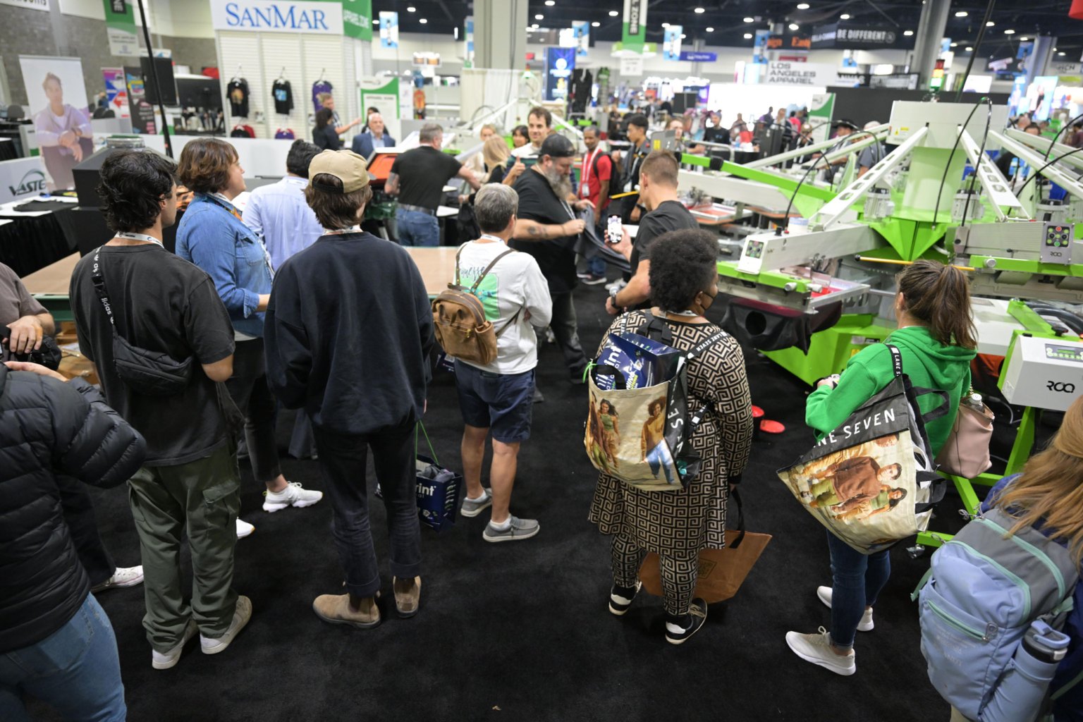 ROQ.US debuted its ROQ Impress for DTF and DTF, offering eight stations for pre-treating, heat pressing, and flash curing for an expedited workflow.