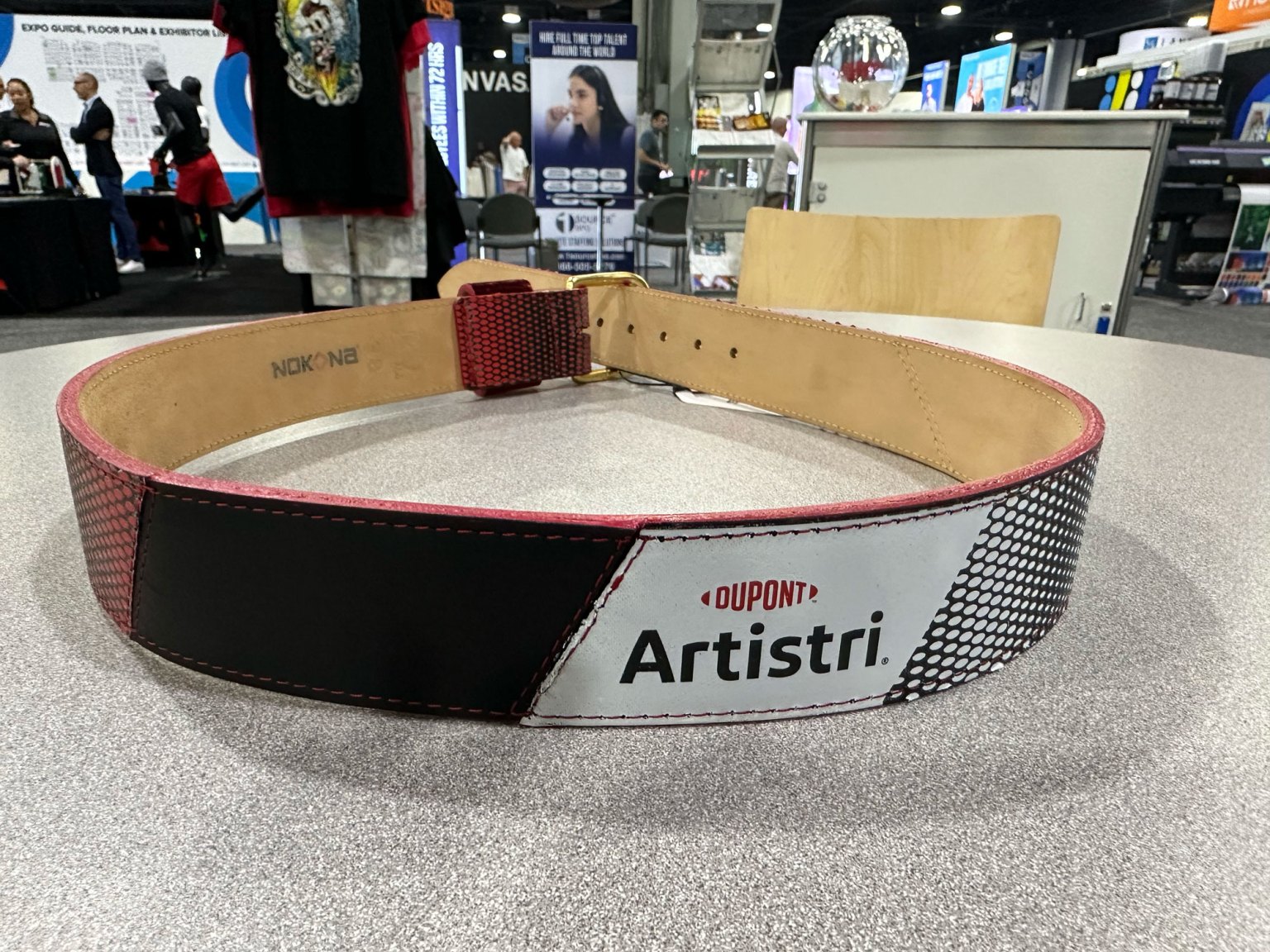 Dupont Artistri Inks highlights the variety of substrates compatible with direct-to-film technology, like this belt. Dupont was printing via a Cobraflex DTF Printer at the expo.