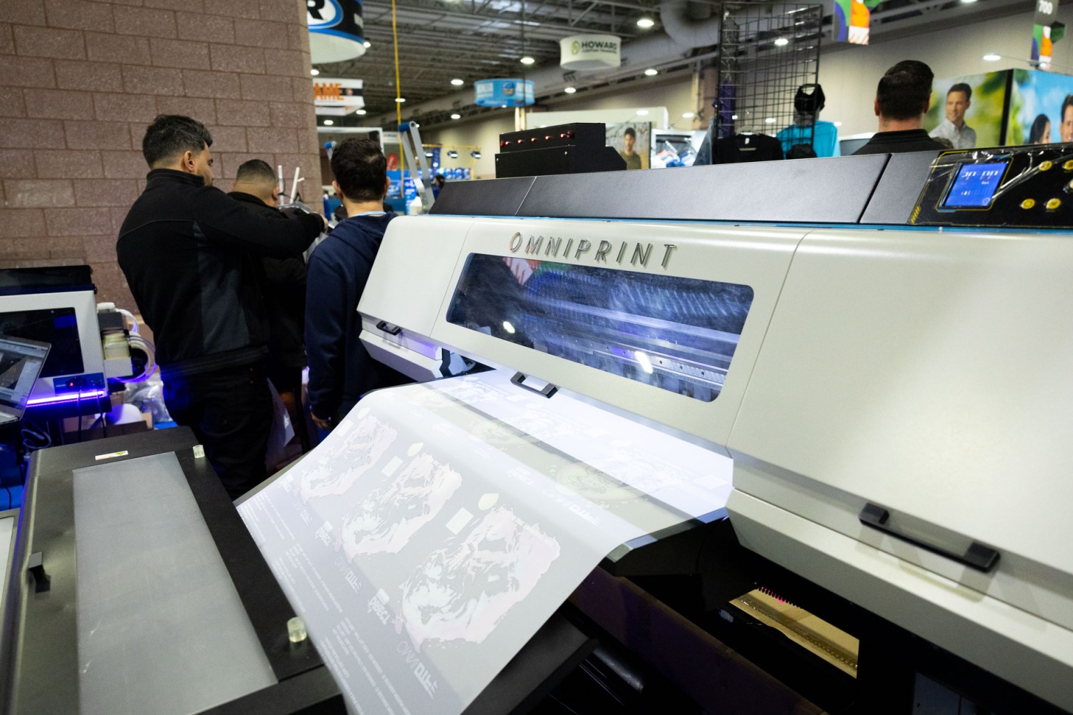 The Omniprint OmniDTF printer prints 14.5 inches wide by up to 238 feet continuously and includes a transfer sheet dryer.