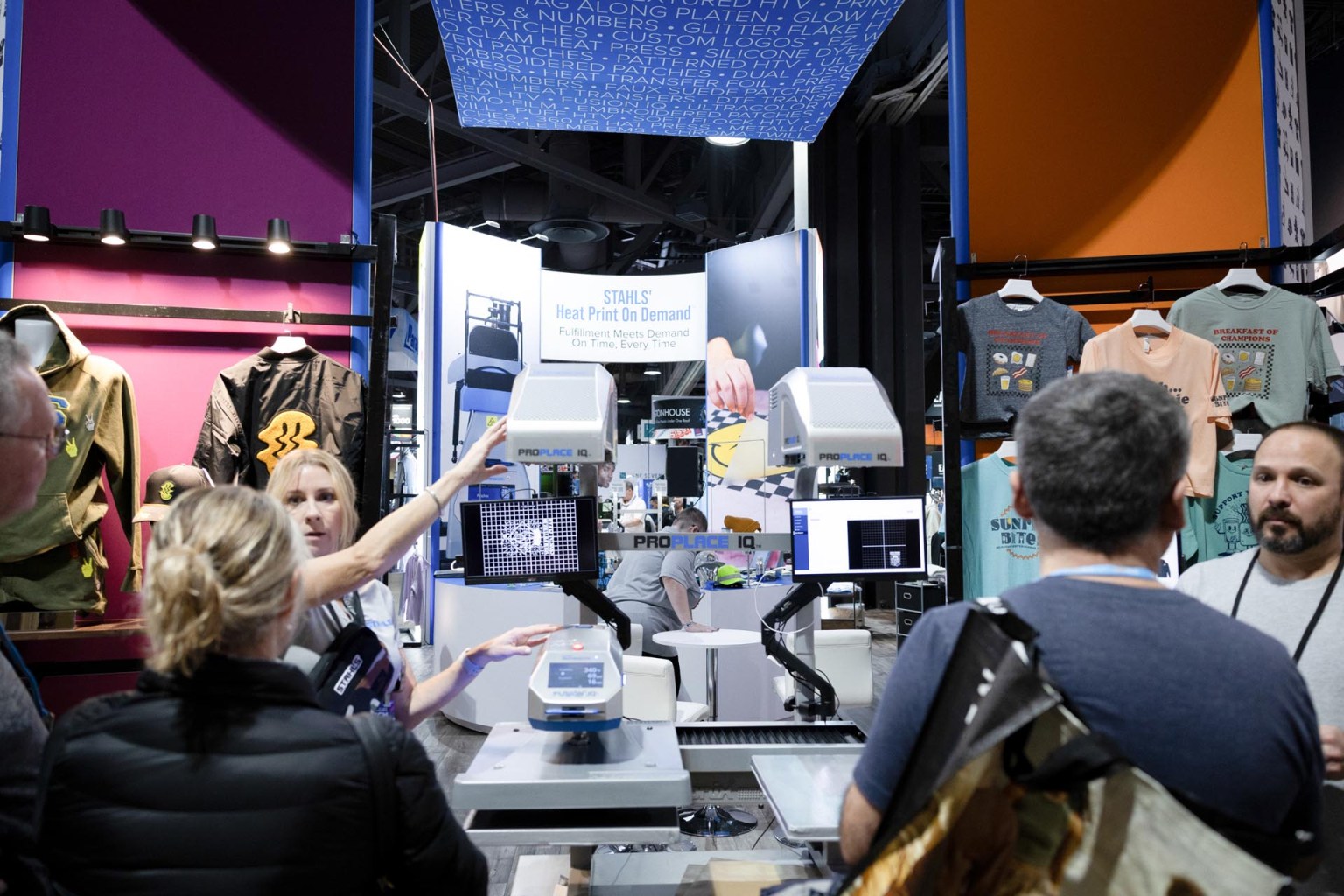 A Stahls’ team member gives a demonstration of the Hotronix ProPlace IQ. This system features a patented projection alignment system and projects designs directly onto the platen.