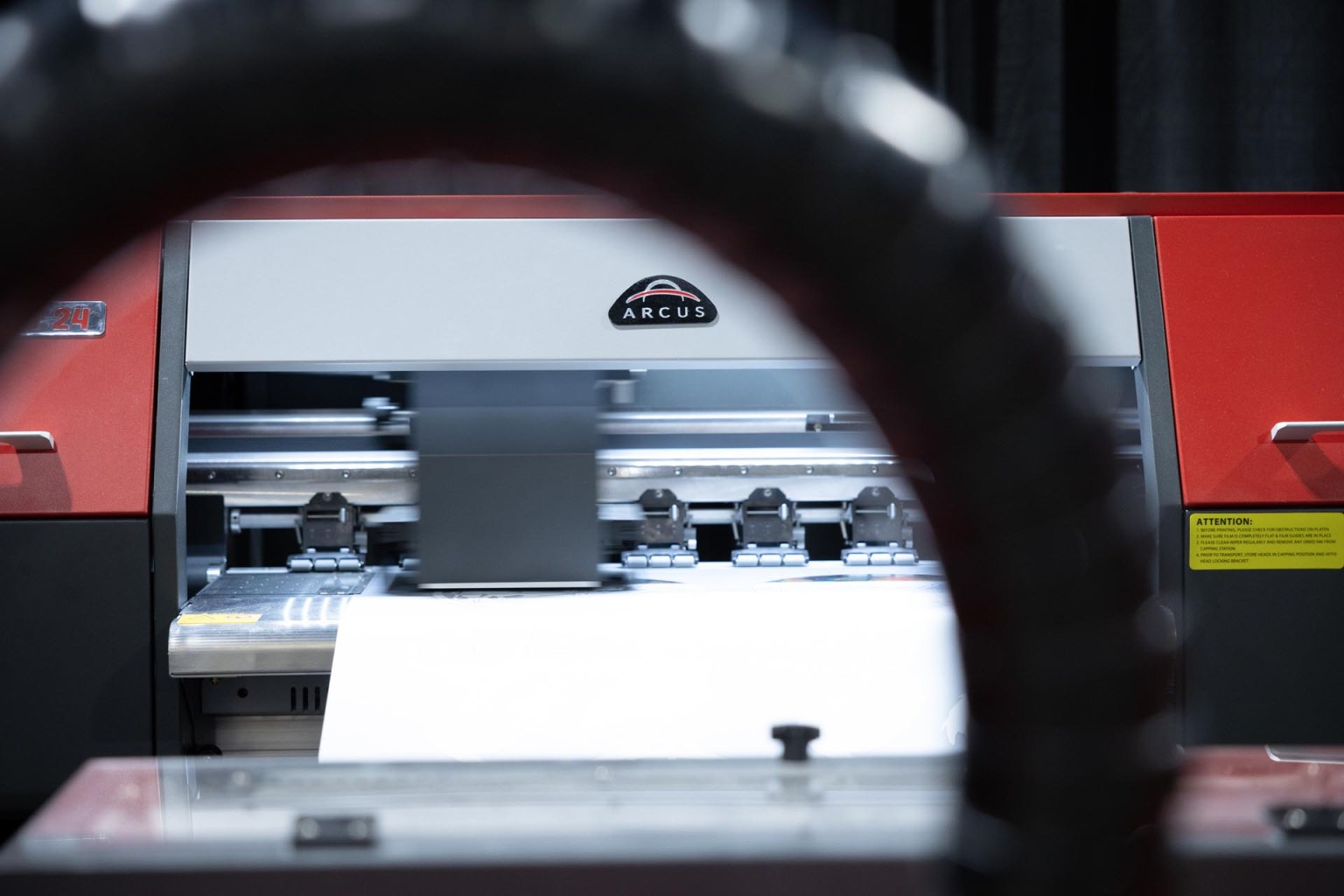 Axiom America provides DTF printing solutions, including the Arcus DTF Printer 14-inch Complete System Package. The Arcus features dual Epson I-3200-A1 printheads, four-, six-, and eight-pass print resolution, and prints graphics up to 1440 dpi.