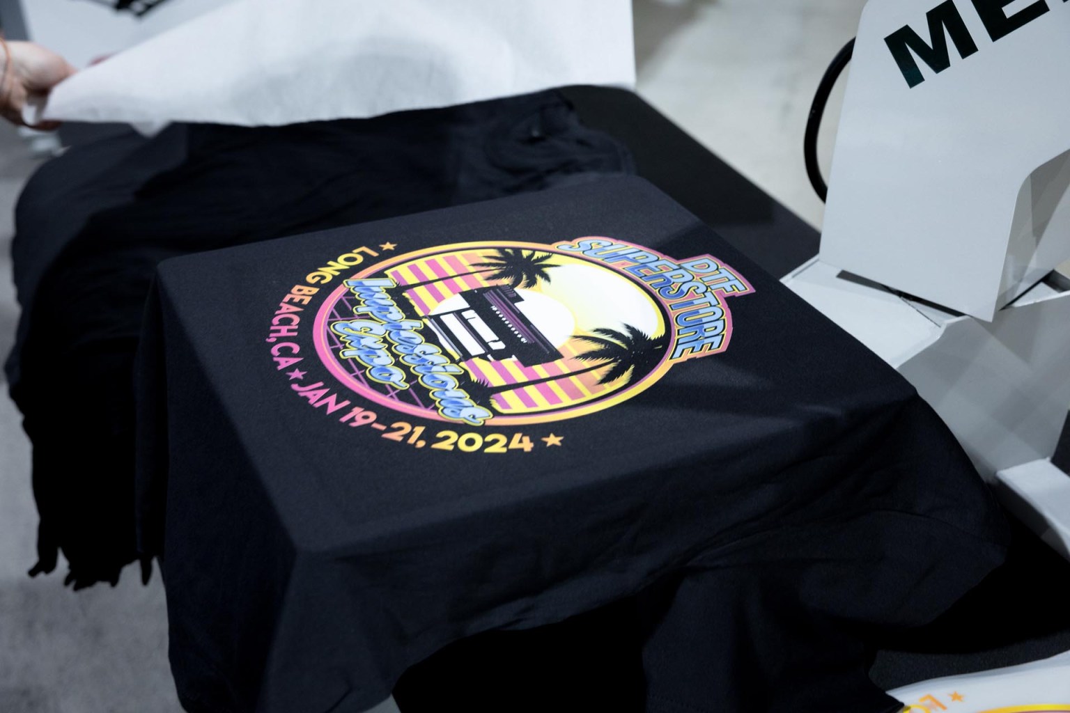 DTF Superstore printed custom Impressions Expo Long Beach show shirts via its Mimaki TxF300-75 direct-to-film printer.
