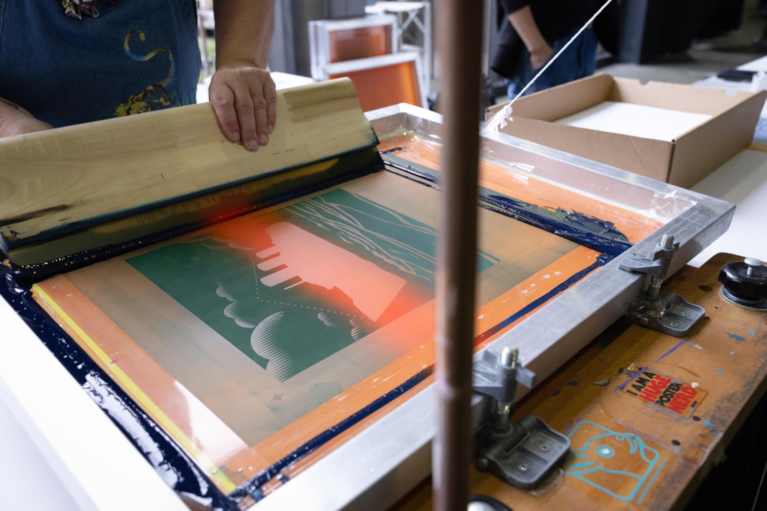 Famous flatstock printer Andy MacDougall live printed posters designed by Alyx Spurrier for Ink Kitchen’s Impressions Expo Long Beach fundraiser. More than $20,000 worth of donations were given to Care Closet. Care Closet is a non-profit that works directly with the unhoused and those challenged with reforming themselves to become members of society. DTF Printing is a proud sponsor.