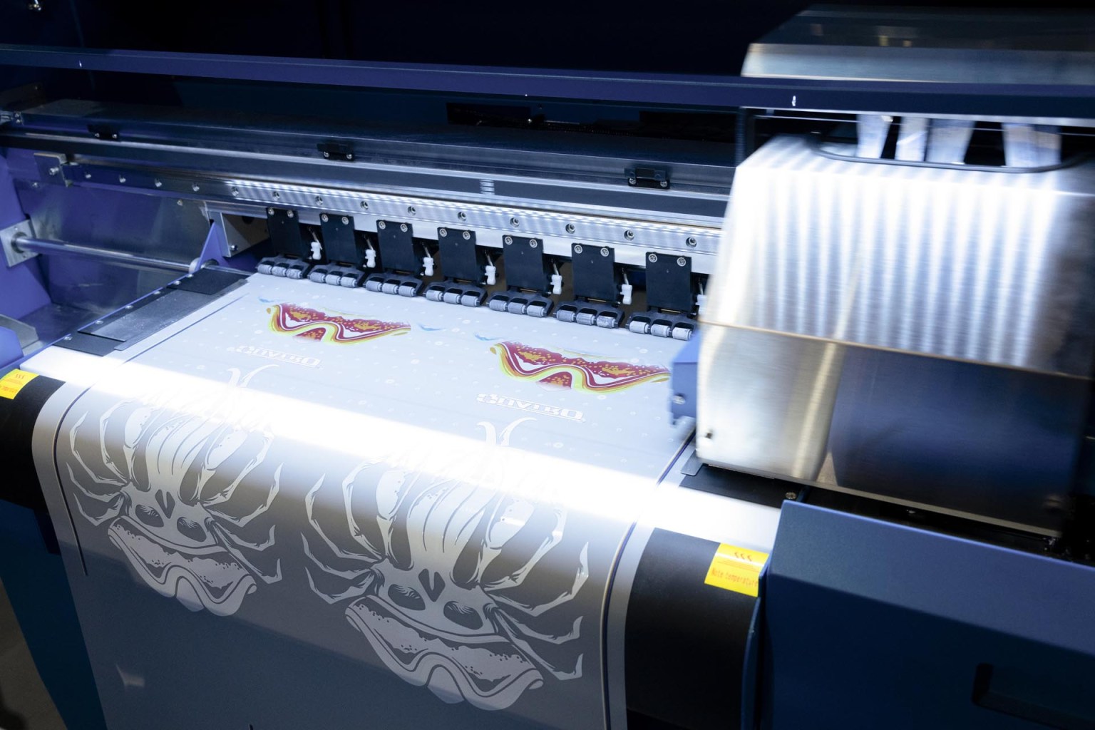 The 24-inch M&R Quatro is a high-resolution industrial inkjet printer designed for direct-to-film printing. The CMYK+W inks used in the process enables the reproduction of complex designs with gradients, shadows, and a wide gamut of colors. Read more about the M&R Quatro DTF printer here.