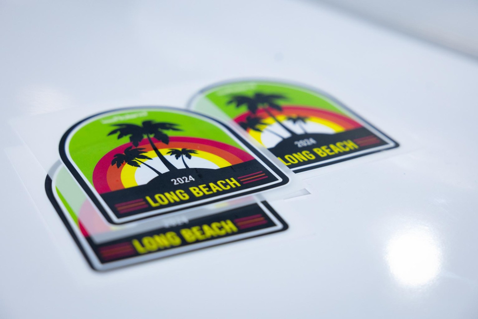 Long Beach-themed designs flooded the booths at Impressions Expo Long Beach. Here you can see an example from Roland DGA via its new BY-20 desktop direct-to-film water-based printer.