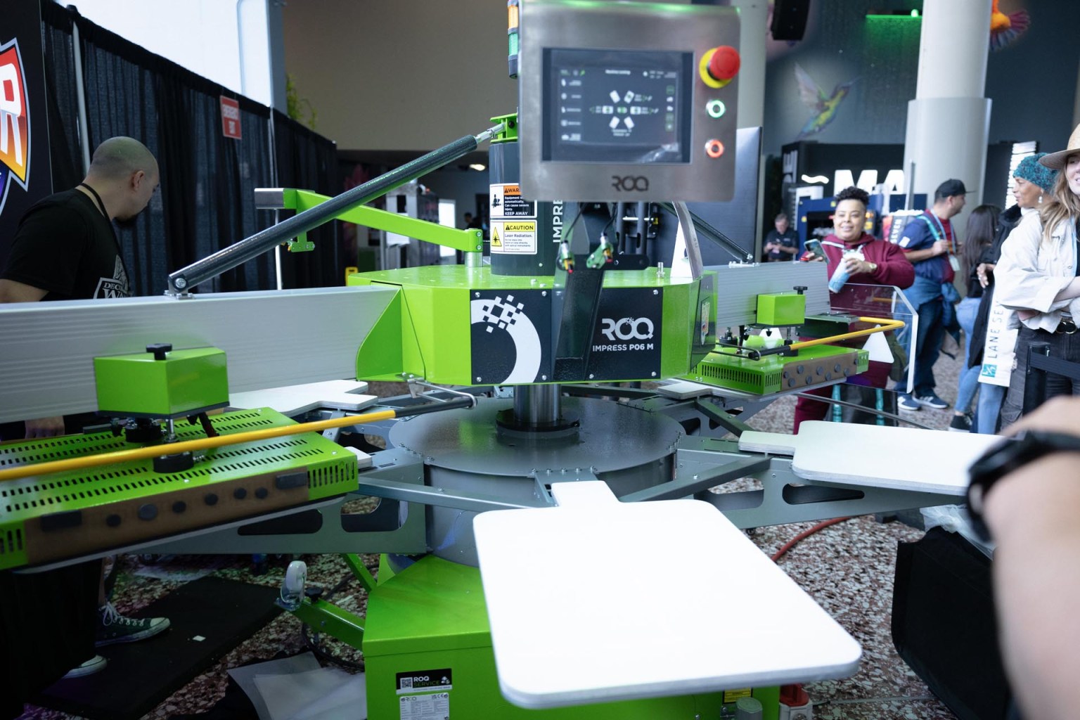 The Roq Impress is an automated heat transfer press built to press multiple types of heat transfers including DTF, screen print, digital/screen hybrid, vinyl, and specialty transfers. At Impressions Expo, Supacolor hosted the machine with its DTF heat transfers. Read more about the ROQ Impress here.