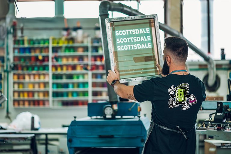scottsdale arizona screen printer worker preparing screen printing film in work 768x511